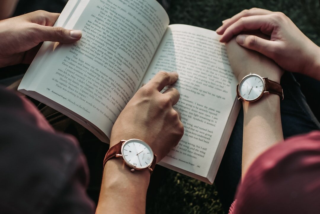 close up of hands holding book