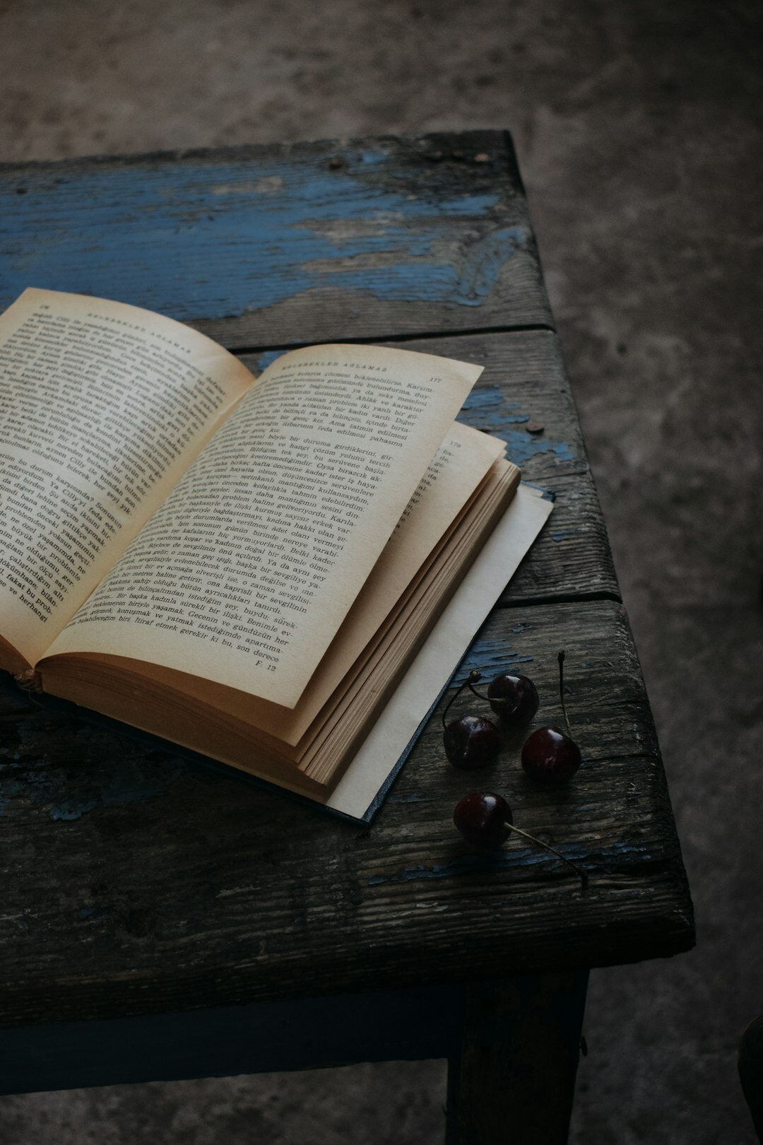 open mystery book on wooden table